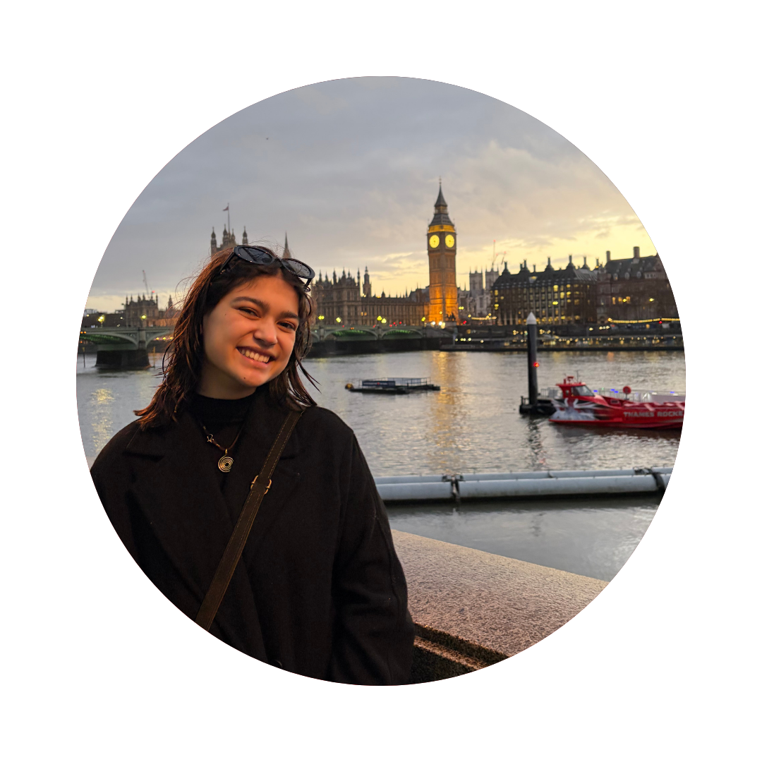 Image of Lyra standing near the Thames and Big Ben